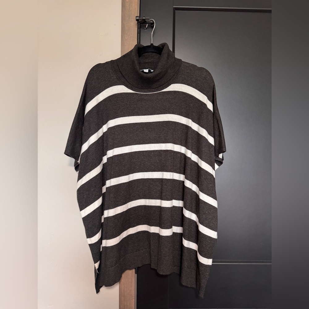 Turtleneck tunic length sweater, charcoal gray background, size is OS, fits 2XL